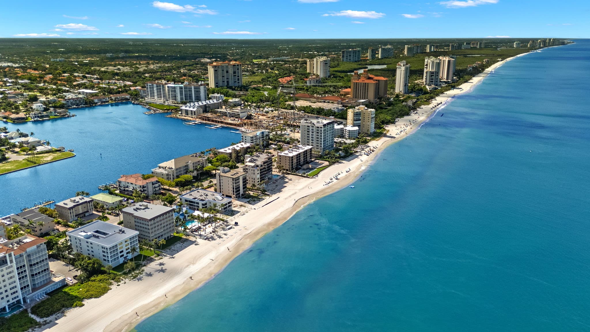 The Southwest Florida Gulf coastline from the air — white sand beaches and coastal communities
