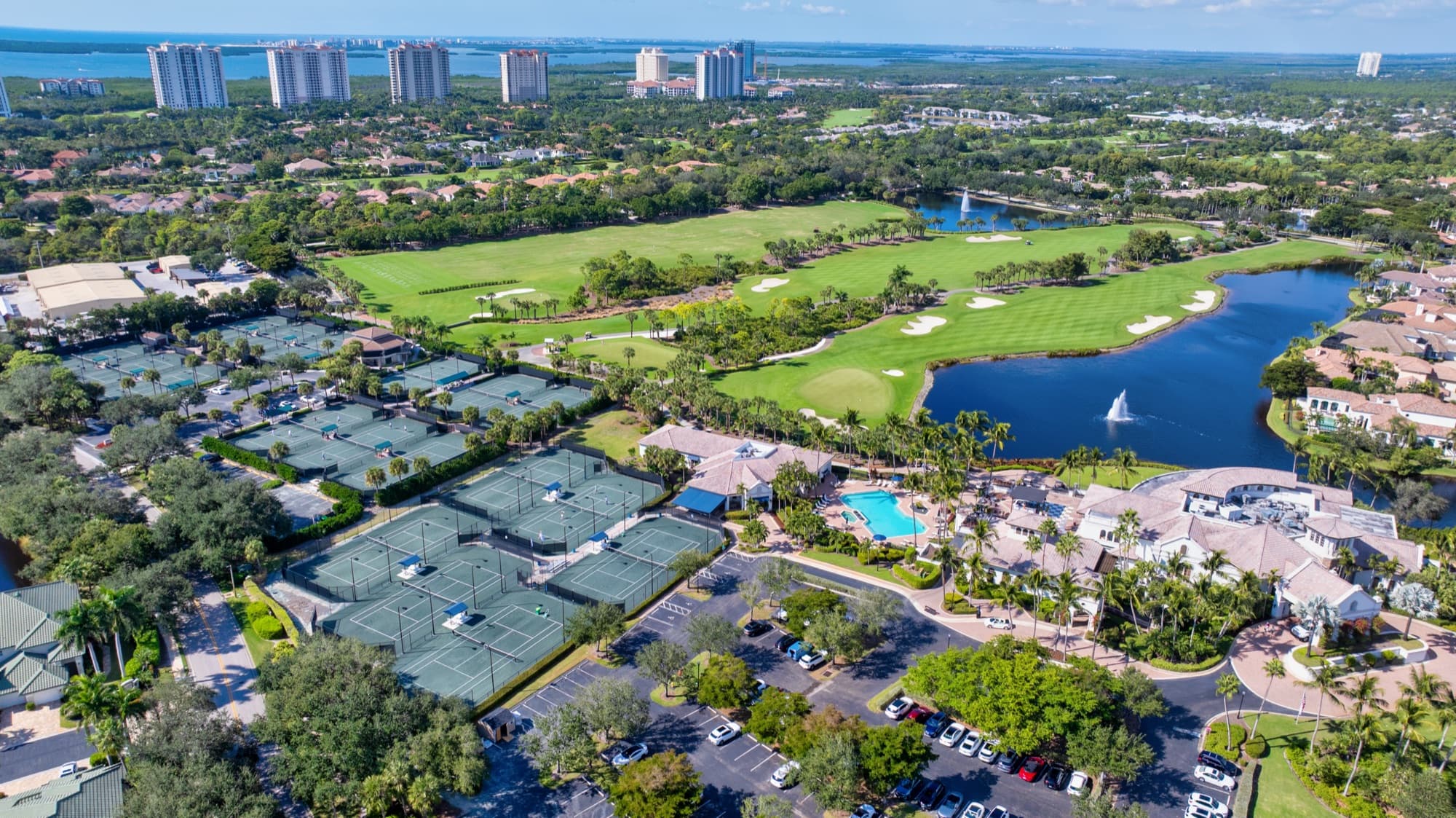 Aerial view of tennis courts, pool, and amenity campus at The Colony at Pelican Landing