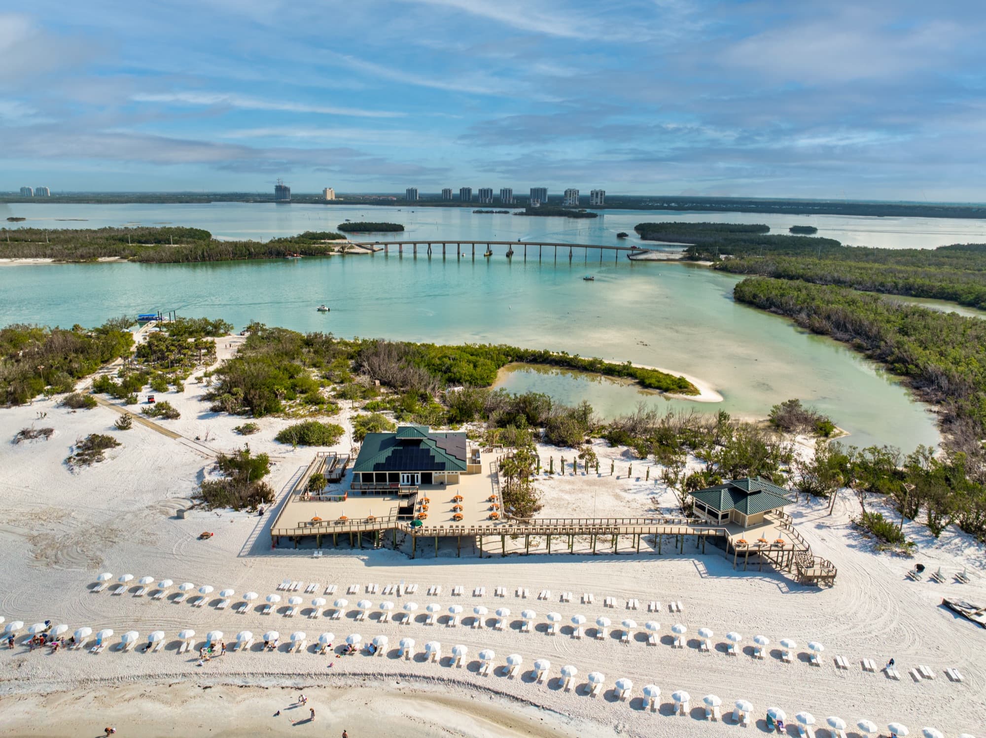 View from the private beach island looking back toward The Colony's high-rise towers